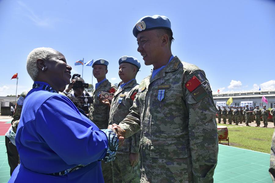 Capacetes azuis sob a bandeira com cinco estrelas - 35 anos da China em missões de paz da ONU trazem paz e segurança